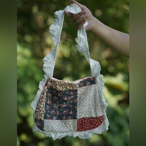 A **vintage fabric bag** with a **patterned design**.